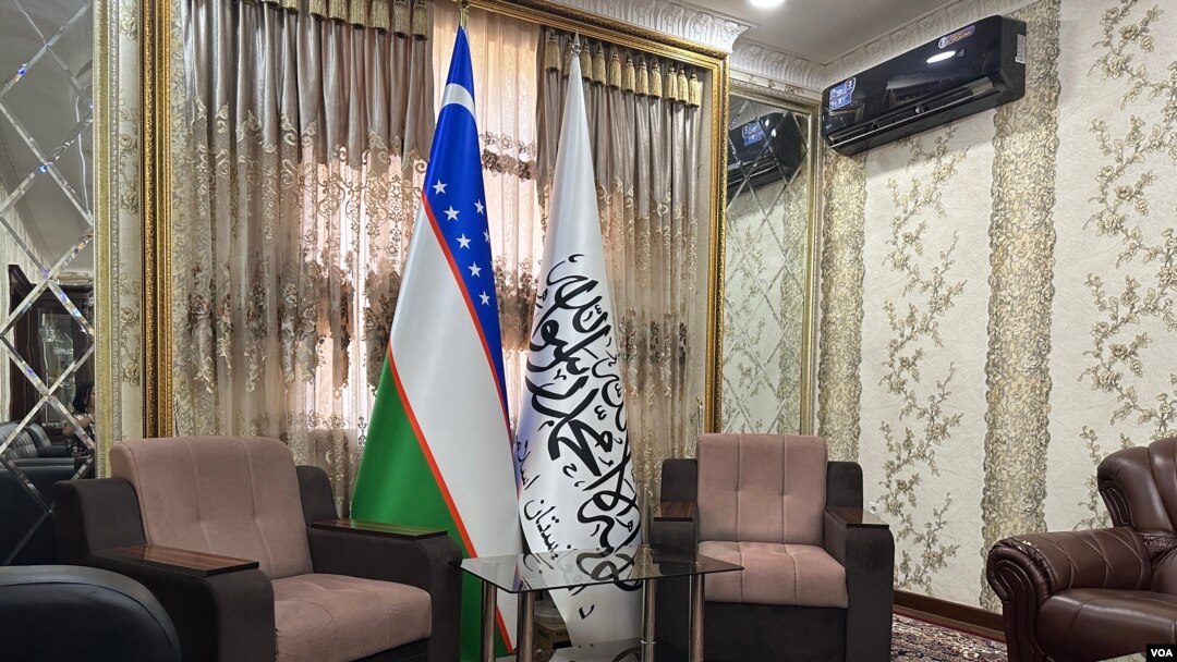 Uzbekistan and the Taliban flags side by side inside the Afghan Consulate in Termez, Uzbekistan, even though outside the compound still keeps the flag of the Islamic Republic of Afghanistan. Aug. 10, 2023. 