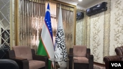Uzbekistan and the Taliban flags side by side inside the Afghan Consulate in Termez, Uzbekistan, even though outside the compound still keeps the flag of the Islamic Republic of Afghanistan. Aug. 10, 2023. 