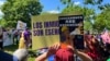 Immigrant advocates rally in Washington, D.C., May 1, 2024, urging President Joe Biden to grant work permits for long-term undocumented immigrants living in the United States. (Salome Ramirez/VOA LATAM)