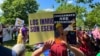 Immigrant advocates rally in Washington, D.C., May 1, 2024, urging President Joe Biden to grant work permits for long-term undocumented immigrants living in the United States. (Salome Ramirez/VOA Latam)