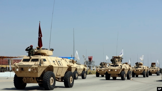 Taliban Military Vehicles are seen during a military parade to mark the third anniversary of the withdrawal of U.S.-led troops from Afghanistan, in Bagram Air Base, Aug. 14, 2024.