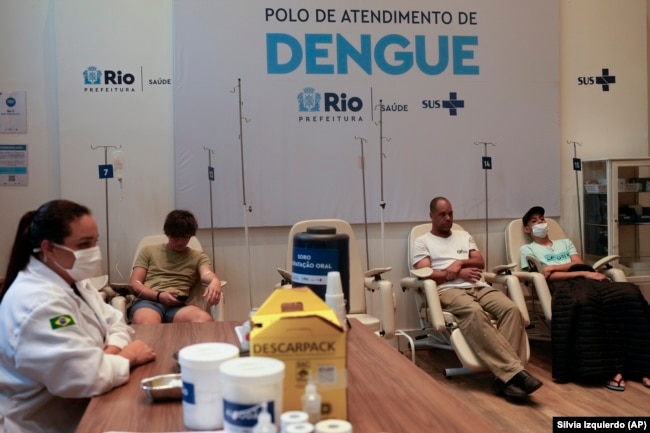 FILE - Patients suspected of having dengue fever get care at a health center in Rio de Janeiro, Brazil, Feb. 23, 2024. (AP Photo/Silvia Izquierdo)