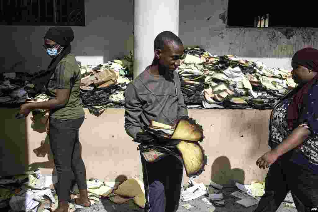 Archival and documentation students sift through burned documents at the Cheikh Anta Diop University in Dakar, Senegal, in an effort to salvage them.&nbsp;Tens of thousands of student archives dating back to 1957 were burned during a protest that broke out June 1, after opposition leader Ousmane Sonko was sentenced to two years in prison.