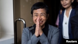 FILE - Philippines Nobel laureate Maria Ressa faces the media after she and her news site Rappler were acquitted of tax fraud, in Pasig City, Metro Manila, Philippines, Sept. 12, 2023. On Dec. 12, 2023, the Philippine Justice Department dropped a criminal case against Ressa.