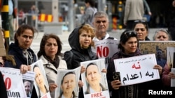 FILE - A demonstration supporting the Swedish-Iranian doctor and researcher Ahmadreza Djalali, who is imprisoned and sentenced to death in Iran, was held in Stockholm, May 14, 2022.