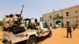 FILE: Security forces prepare to escort Sudan's ex-president Omar al-Bashir (not in the picture) from the National Prison in Khartoum, Sudan Taken Jun. 16, 2019. 