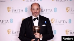Режиссер Эдвард Бергер c премией BAFTA.
Credit: Reuter 