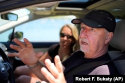 Paul Hodgson talks about the anger in the community over one homeowner's poisoning of a neighbor's trees to gain a waterfront view, Tuesday, June 4, 2024, in Camden, Maine. (AP Photo/Robert F. Bukaty)