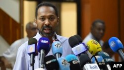 FILE - Former Cabinet minister and now spokesperson representing both parties in Sudan's political transition Khalid Omar speaks to the press in the capital Khartoum, May 8, 2019.