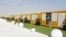 FILE - Cabins line the World Cup fan village, Nov. 10, 2022, in Doha, Qatar. 