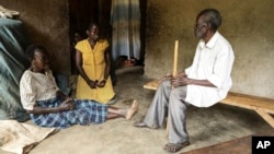 Barbara Nabulo interacts with her parents at Kilombe village in Mbale, Uganda, April. 26, 2024. People with sickle cell disease sometimes face lifelong challenges in rural Uganda, where the disease remains poorly understood.