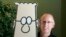 FILE - Scott Adams, creator of the comic strip 'Dilbert,' poses with the Dilbert character in his studio in Dublin, Calif., Oct. 26, 2006. 