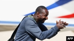 FILE - Freed French hostage journalist Olivier Dubois, who was held hostage in Mali for nearly two years by the Support Group for Islam and Muslims reacts as he arrives at the Villacoublay airport, in Velizy-Villacoublay, near Paris, March 21, 2023.