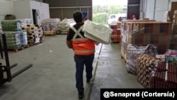 El Servicio de Preparación y Respuesta ante Desastres de Chile entrega donaciones a sectores afectados por lluvias. Cortesía