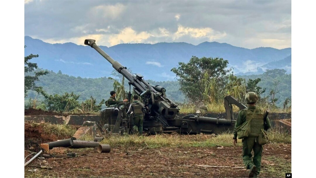 FILE - In this photo provided by the Kokang online media, members of an ethnic armed forces group check weapons the group allegedly seized from Myanmar's army outpost on a hill in Hsenwi township in Shan state, Myanmar, Nov. 24, 2023.