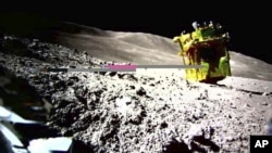 This image provided by the Japan Aerospace Exploration Agency (JAXA) shows an image of a robotic moon rover called Smart Lander for Investigating Moon, or SLIM, on the moon. (JAXA/Takara Tomy/Sony Group Corporation/Doshisha University via AP)