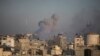 Smoke rises from town of Khan Younis after Israeli strikes on Dec. 15, 2023. 