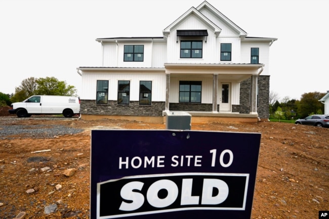 FILE - A home under construction is marked as "sold" at a development in Eagleville, Pennsylvania, April 28, 2023.
