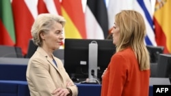 European Commission President Ursula von der Leyen speaks with European Parliament President Roberta Metsola prior a debate on the results of the war of aggression by Russia against Ukraine, at the European Parliament in Strasbourg, Feb. 15, 2023. 