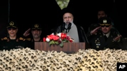 Iranian President Ebrahim Raisi speaks during Army Day parade at a military base in northern Tehran, April 17, 2024. 