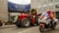 Farmers, escorted by the police, march with tractors during a protest outside the European Parliament in Brussels, Belgium, June 4, 2024.