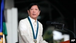 FILE - Philippines' President Ferdinand Marcos Jr. delivers his speech at Camp Aguinaldo military headquarters in Quezon city, Dec. 21, 2023. 
