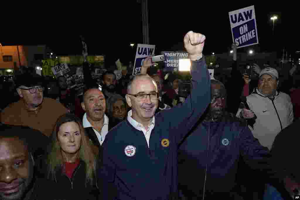 United Auto Workers President Shawn Fain walks with union members striking at Ford&#39;s Michigan Assembly Plant in Wayne, Michigan. (AP Photo/Paul Sancya)