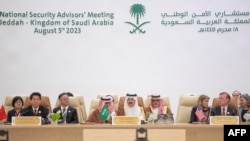 A handout picture provided by the Saudi Press Agency (SPA) on Aug. 6, 2023, shows Saudi Arabia's National Security adviser and Minister of State Musaad bin Mohammed al-Aiban (C) speaking during a National Security Advisers' meeting in Jeddah.