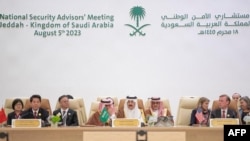 A handout picture provided by the Saudi Press Agency (SPA) on Aug. 6, 2023 shows Saudi Arabia's National Security advisor and Minister of State Musaad bin Mohammed al-Aiban (C) speaking during a National Security advisors' meeting in Jeddah. 