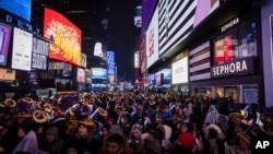 FILE - Revelers celebrate in Times Square as they attend the New Year's Eve celebrations on Dec. 31, 2022 in New York.