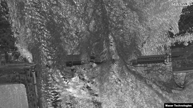 This satellite image provided by Maxar Technologies shows an overview of the damaged Kakhovka dam in southern Ukraine on Tuesday, June 6, 2023.