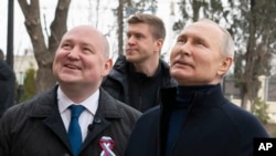 Russian President Vladimir Putin, right, and Governor of Sevastopol Mikhail Razvozhayev visit Sevastopol, Crimea, March 18, 2023. Putin traveled to Crimea to mark the ninth anniversary of Russia annexing Crimea from Ukraine, a move most of the world denounced as illegal.