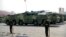 FILE - Chinese military vehicles carrying DF-17 ballistic missiles roll during a parade to commemorate the 70th anniversary of the founding of Communist China in Beijing, on Oct. 1, 2019.