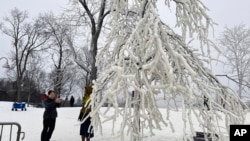 Mist from the Great Falls has created a frozen wonderland around the waterfalls in Paterson, New Jersey, on Jan. 18, 2024. 