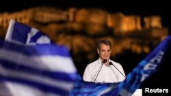 FILE - Greek Prime Minister and leader of the conservative New Democracy ruling party Kyriakos Mitsotakis addresses supporters during a pre-election rally in Athens, Greece, May 19, 2023. 
