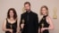 Ukrainian filmmaker Mstyslav Chernov, center, Raney Aronson-Rath and Michelle Mizner, right, pose with the Oscar for Best Documentary Feature Film for "20 Days in Mariupol," at the 96th Academy Awards in Hollywood, Los Angeles, California, March 10, 2024. 