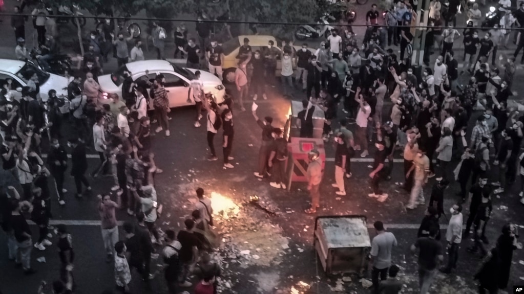 FILE - Iranians protest the death of Mahsa Amini, 22, after she was detained by the morality police, in Tehran, Sept. 20, 2022, in this photo taken by an individual not employed by The Associated Press and obtained by the AP outside Iran.
