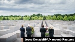 French President Emmanuel Macron, German President Frank-Walter Steinmeier and first ladies Brigitte Macron and Elke Buedenbender visit Berlin&#39;s Holocaust Memorial dedicated to the six million Jews murdered by the Nazis, in Berlin.