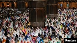 Muslim women attend mass prayers known as &#39;Tarawih&#39; during the first eve of the holy fasting month of Ramadan, at the Great Mosque of Istiqlal in Jakarta, Indonesia.
