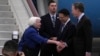 U.S. Treasury Secretary Janet Yellen, left, shakes hands with U.S. Ambassador to China Nicolas Burns as Chinese Ministry of Finance Vice Minister Liao Min looks on, at Guangzhou Baiyun Airport in southern China's Guangdong province, April 4, 2024.