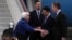 U.S. Treasury Secretary Janet Yellen, left, shakes hands with U.S. Ambassador to China Nicolas Burns as Chinese Ministry of Finance Vice Minister Liao Min looks on, at Guangzhou Baiyun Airport in southern China's Guangdong province, April 4, 2024.