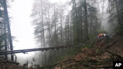A part of the Shimla-Kalka heritage railway track is seen washed away following heavy rainfall on the outskirts of Shimla, Himachal Pradesh state, India.&nbsp;