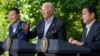President Joe Biden, center, speaks with Japanese Prime Minister Fumio Kishida, right, and South Korean President Yoon Suk Yeol during a joint news conference, Aug. 18, 2023, at Camp David in Maryland. 