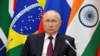 El presidente ruso, Vladimir Putin, participa por video en la cumbre del BRICS en Johanesburgo, Sudáfrica, el 23 de agosto de 2023. Foto de Sputnik divulgada por Reuters.