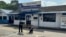A police forensic member takes a picture outside of a police station where a man killed two officers in Ulu Tiram, Johor state, Malaysia, May 17, 2024. 