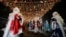 Participants dressed as Ayaz Ata (Father Frost) - the Kazakh equivalent of Santa Claus, take part in a procession through city streets while marking the New Year and Christmas season in Almaty, Kazakhstan, Dec. 25, 2023. 