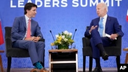 FILE - Canadian Prime Minister Justin Trudeau, left, and U.S. President Joe Biden meet in Mexico City, Jan. 10, 2023. Biden will meet Trudeau again during a visit to Ottawa this week.