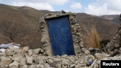 A blue door is seen surrounded by rubble in the devastated village of Adouz after the deadly earthquake in Morocco, Sept. 12, 2023. 