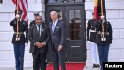 FILE - Papua New Guinea's Prime Minister James Marape and U.S. President Joe Biden meet at the U.S.-Pacific Island Countries Summit, in Washington, Sept. 29, 2022. (Papua New Guinea government/Handout via Reuters)