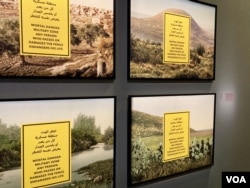 An artwork called "Military Zones" by Hazem Harb shows scenes of Israeli danger warnings over former Palestinian land, on display at the Arab World Institute in Paris. (Lisa Bryant/VOA)